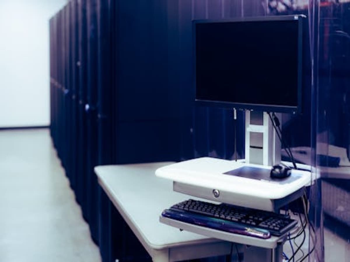 Technician working on business network cabling and infrastructure installation